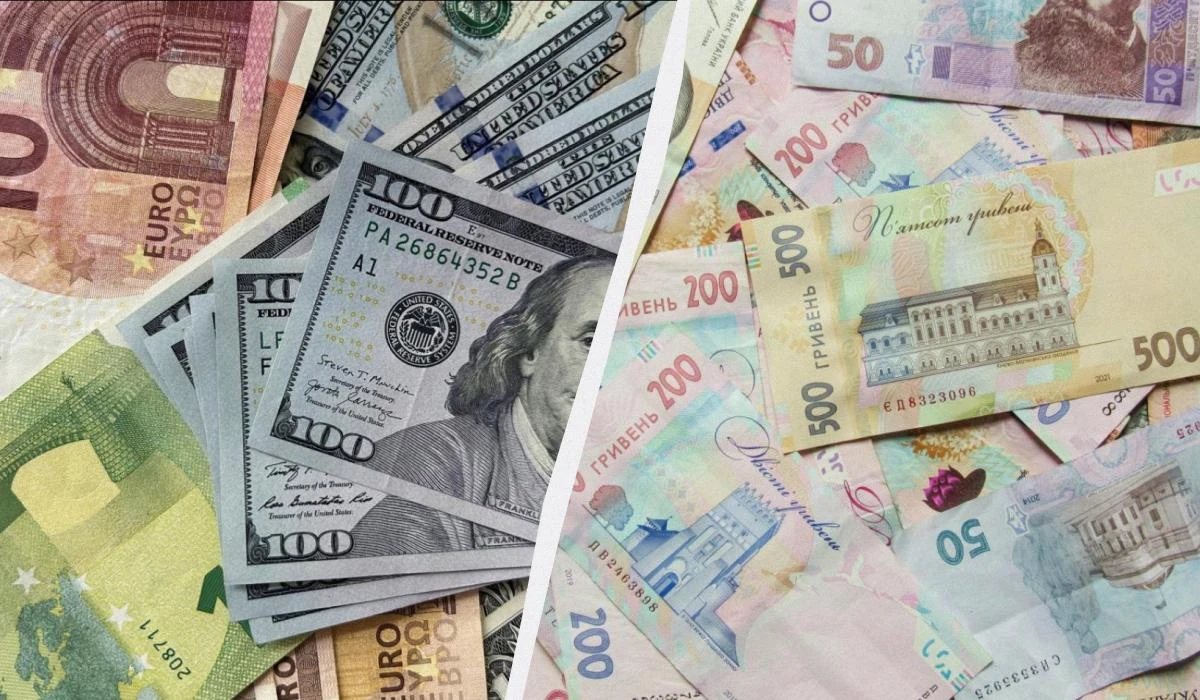Банкноти доларів США, євро та гривні
